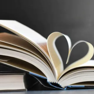 Book with pages turned to heart