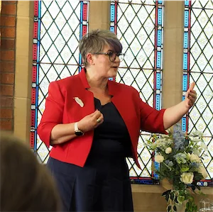 Tatjana demonstrating in Longton wiht hand stretched out